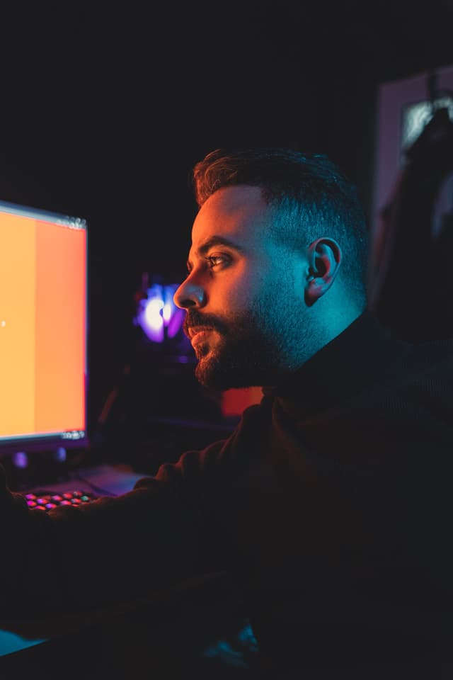 Engineer building AI agent workflows on a laptop